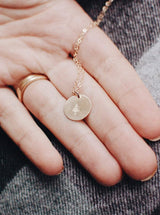 gold necklace with pine tree