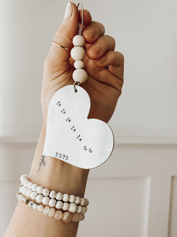 A timeless, custom Christmas ornament stamped to tell your story.